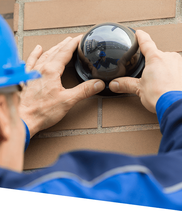 a man installing a security camera