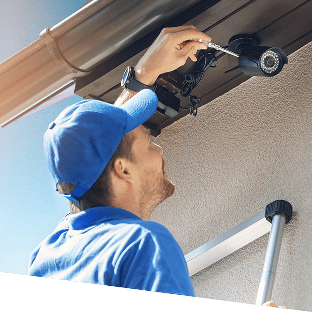 a man installing a security camera