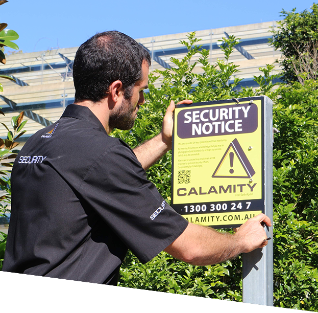 a man putting security notice