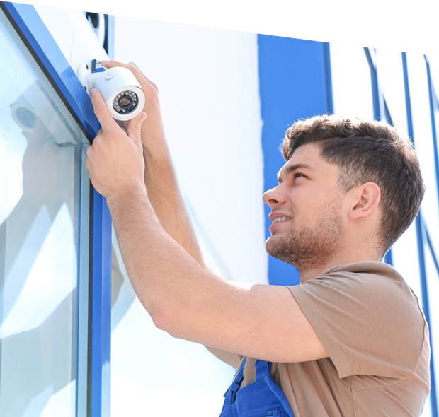 Electrician fixing video surveillance camera