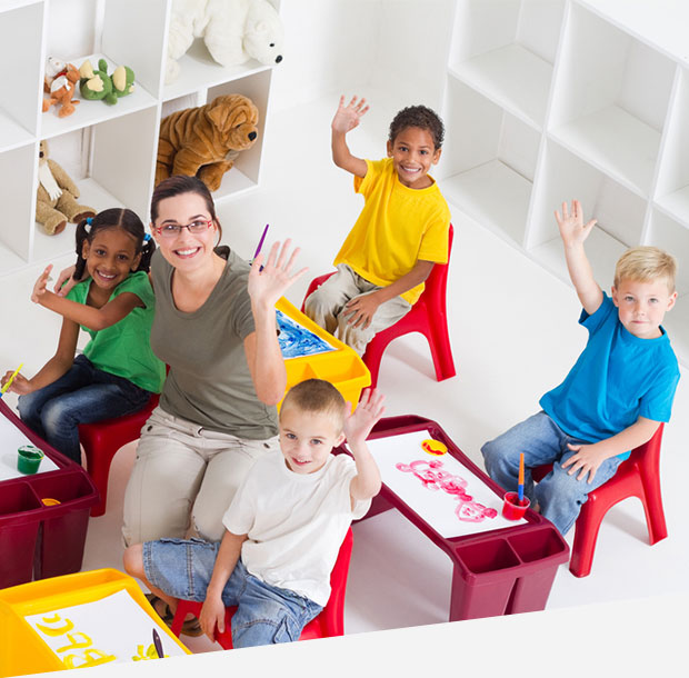 Preschool teacher and students in classroom