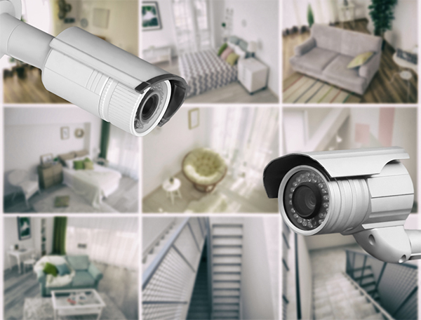 Modern CCTV cameras with blurred view of home locations