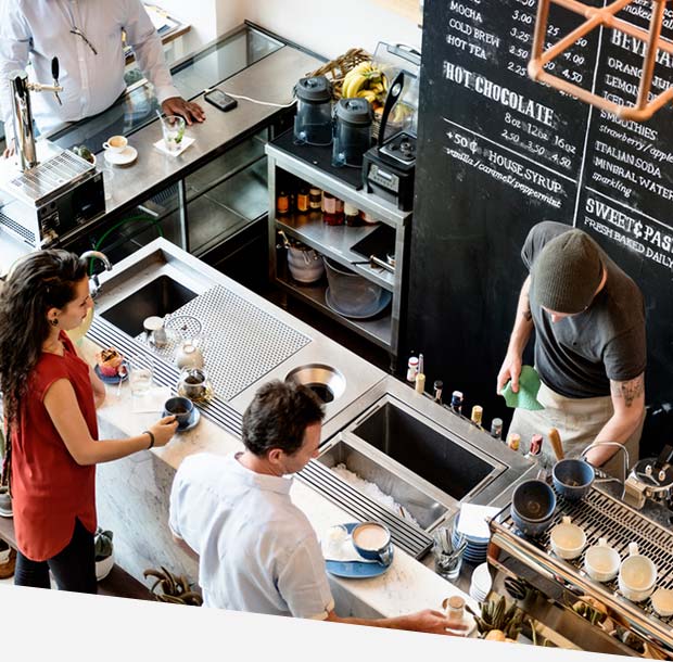 People inside a coffee shop getting orders